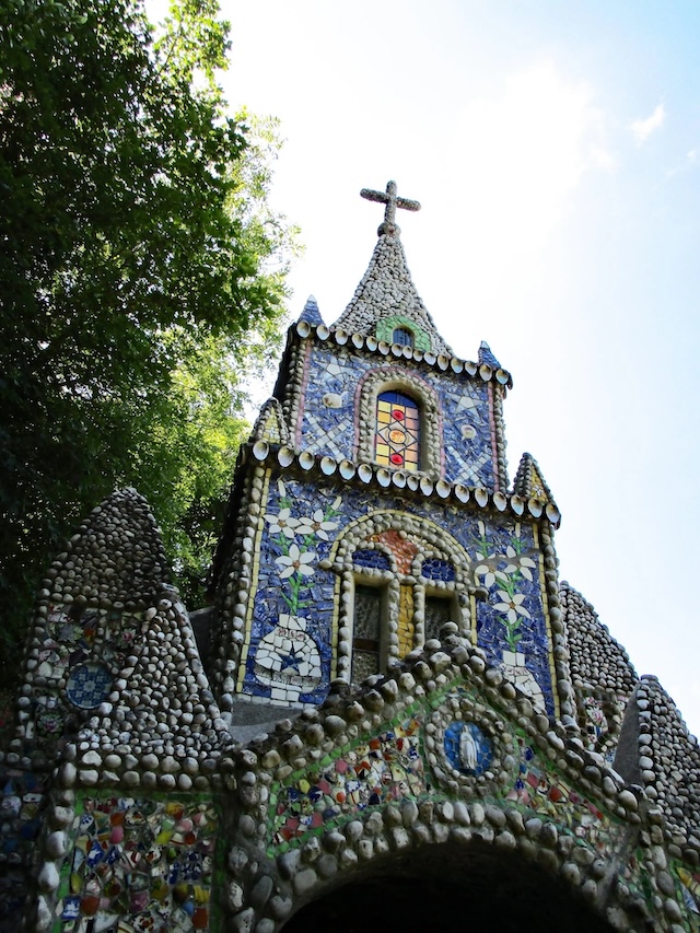 The peaceful surroundings of The Little Chapel, nestled in the serene Guernsey countryside.