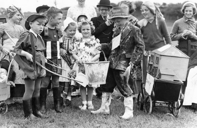 A group of children dressed up for a Field Day costume contest, showcasing creativity, teamwork, and the light-hearted fun that added diversity to the day’s physical competitions