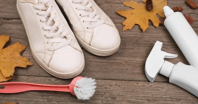 Cleaning essentials for white shoes: a brush, cleaner, and polish – the perfect kit for reviving your favorite sneakers and keeping them fresh