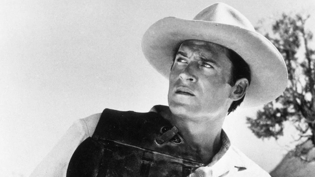 A classic Western still of Clint Walker in full gear, showing his commanding presence on set.