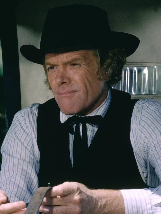 Kevin Hagen as Dr. Hiram Baker - The caring and stern Dr. Baker as portrayed by Kevin Hagen, shown during his time in Walnut Grove and later in life, still evoking respect.