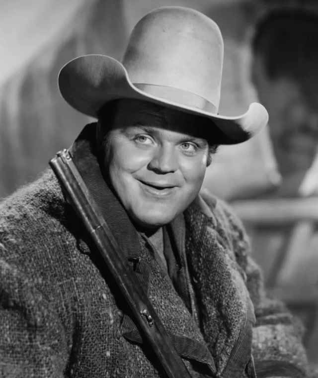 A cheerful portrayal of Dan Blocker as Hoss, exuding warmth and joy. His large size and big heart made him a fan favorite throughout Bonanza's run