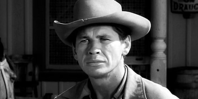 Charles Bronson, known for his tough-guy roles, during his guest appearance on "Gunsmoke," years before his rise to action film fame