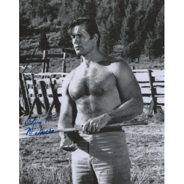 A powerful image of Clint Walker, shirtless and holding a rifle, showing off his athletic build that made him a natural fit for action-packed Westerns.