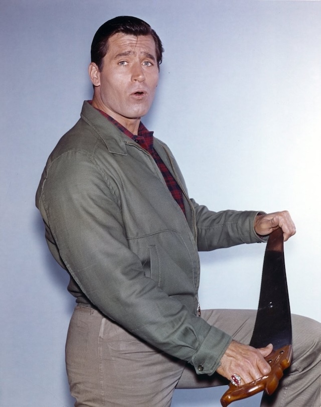 A playful shot of Clint Walker in a casual setting, showcasing his lighter side and affable nature off-screen.