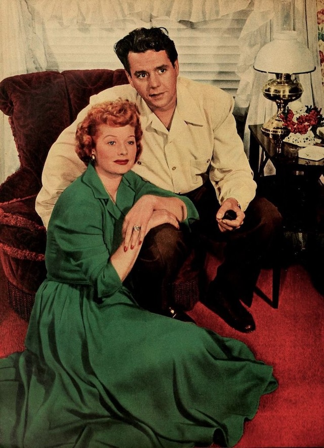 Lucille Ball and Desi Arnaz, the beloved stars of "I Love Lucy," sharing a tender moment at home.