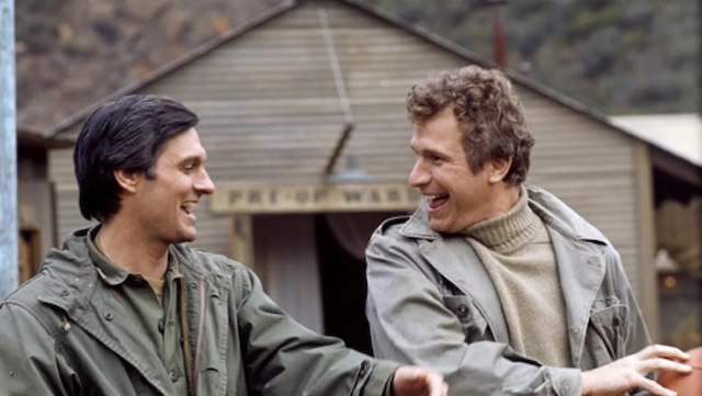 Alan Alda (Hawkeye Pierce) and Mike Farrell (B.J. Hunnicutt) share a laugh on the "M*A*S*H" set. Their characters formed a memorable friendship, filled with witty banter and deep compassion for the soldiers they cared for