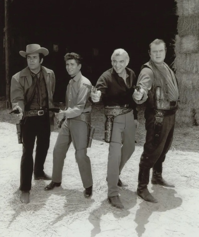 A classic still of the Cartwright men—Little Joe, Adam, Ben, and Hoss—always prepared for adventure and challenges on their vast Ponderosa Ranch.