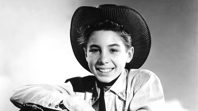 A young Johnny Crawford in character as Mark McCain, the iconic role that brought him stardom in The Rifleman.