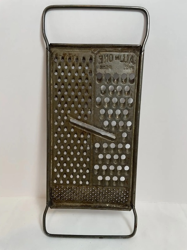 This old-fashioned grater was a kitchen staple, perfect for cheese but always a bit risky for the knuckles!