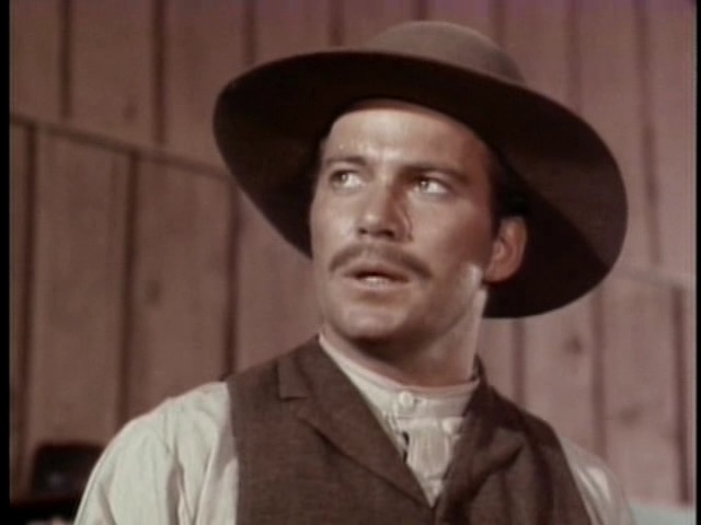 William Shatner appears in a guest role in Gunsmoke before his iconic role as Captain Kirk in Star Trek, bringing a different type of rugged character to life.