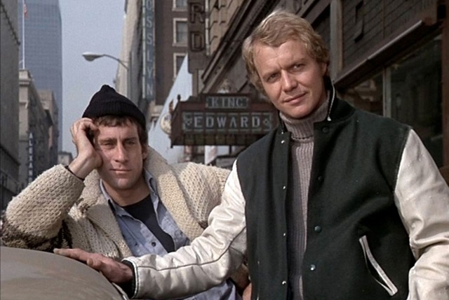 Starsky and Hutch face a tricky situation, with Paul Michael Glaser and David Soul caught in an unexpected moment, typical of the show’s blend of action and humor.