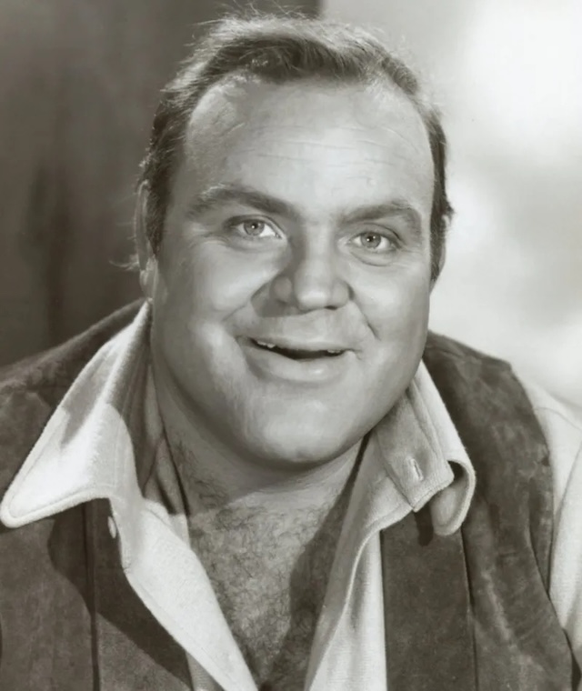 A cheerful portrait of Hoss Cartwright, portrayed by Dan Blocker. His smile and warmth were key to his role as the lovable giant of the Cartwright family