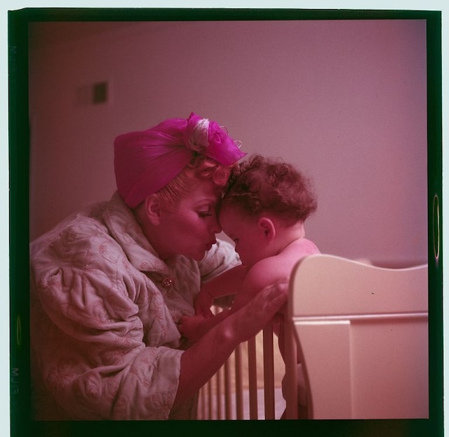 A rare behind-the-scenes glimpse of Lucille Ball doting on a baby, showing her softer side beyond the comedic genius.