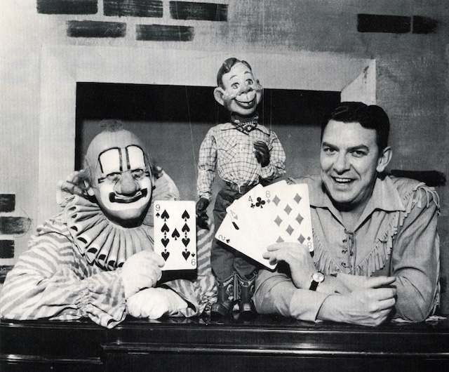 Buffalo Bob, Clarabell the Clown, and Howdy Doody showing off their playful side during a classic episode.