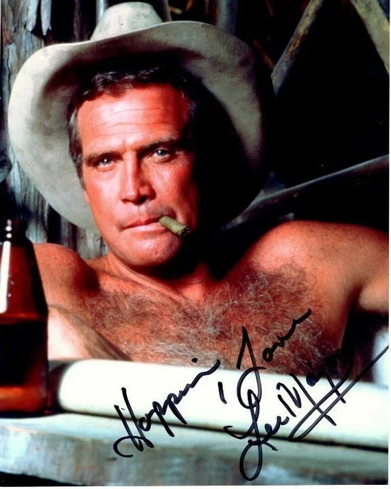 A vintage portrait of Lee Majors as Colt Seavers, the rugged and charming stuntman from "The Fall Guy." With his iconic hat and cigar, he embodied the character's adventurous spirit