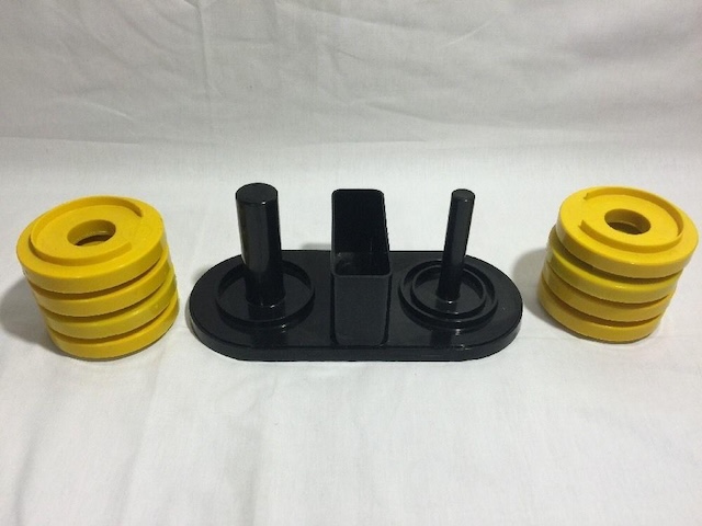 The disassembled pieces of the olfa o weights showing the removable yellow weights and their secure placement