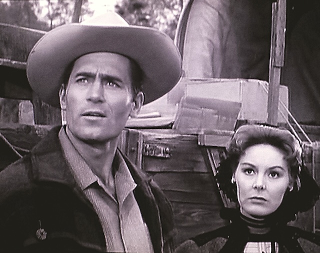 Cheyenne Bodie, ever vigilant and determined, staring into the horizon with his female co-star by his side, always ready to face new challenges in the Old West.