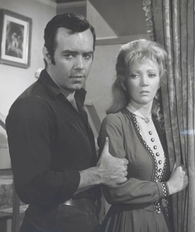 A tense scene with Adam Cartwright and a woman, sharing a moment of concern and caution in Bonanza