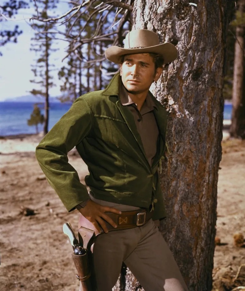 Michael Landon - The rugged cowboy stands by a tree, looking contemplative, ready to draw his gun at any moment