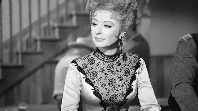 Amanda Blake as Miss Kitty. Her portrayal of the strong-willed saloon owner gave Gunsmoke much of its heart and complexity.