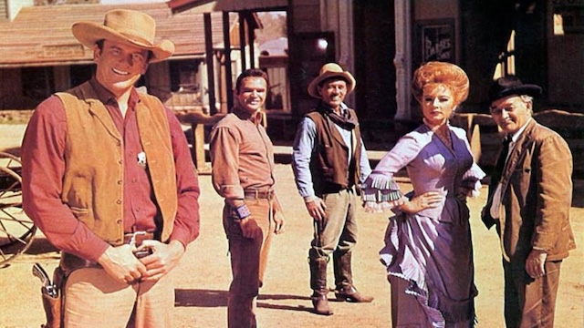 The core cast of Gunsmoke posing together, showing off the rich ensemble that made the show a cultural touchstone for millions of viewers