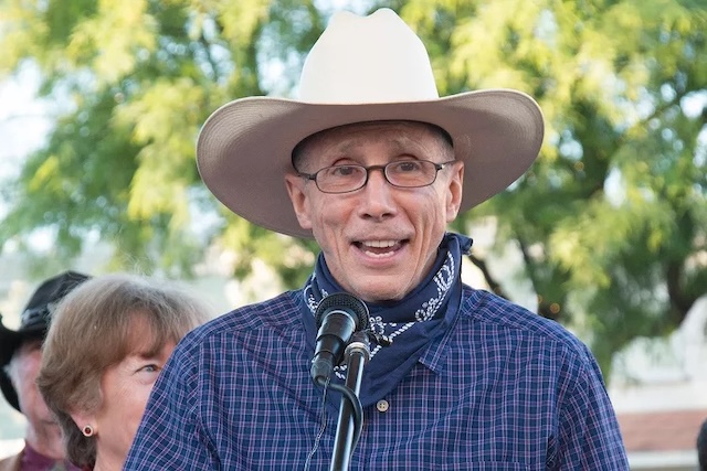 Crawford speaking at an event, showing his enduring connection to fans and the Western genre