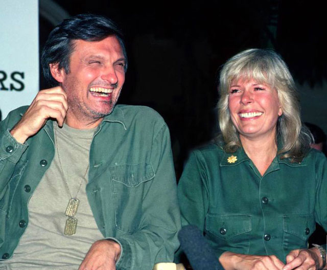 Loretta Swit as Margaret and Alan Alda as Hawkeye Pierce share a playful yet sincere interaction, emphasizing the rich, emotional development between these iconic M*A*S*H characters.