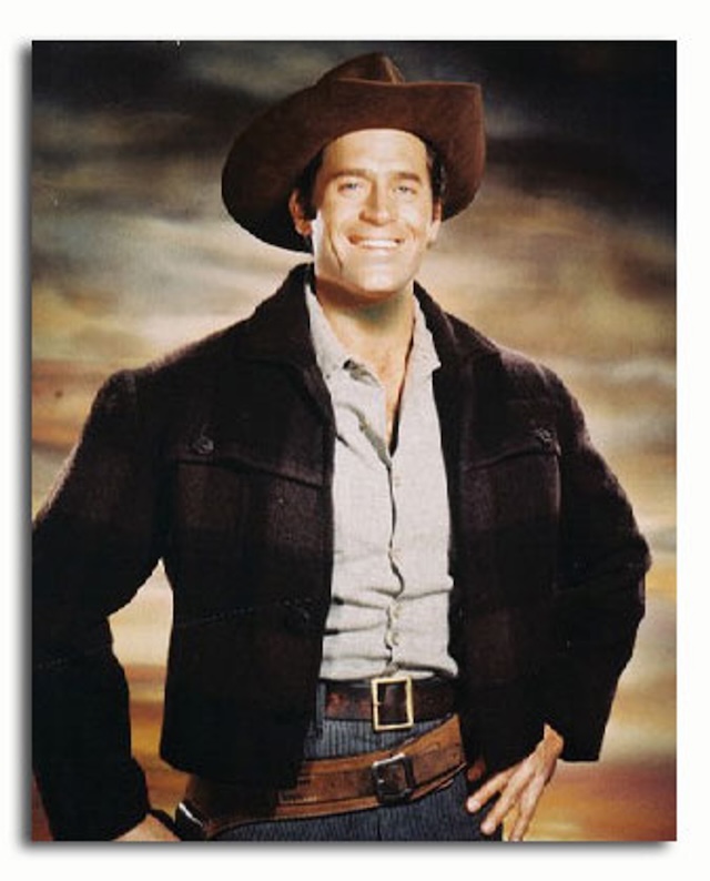 A confident cowboy – Clint Walker in his signature cowboy attire for Cheyenne, exuding charm and strength, qualities that resonated with audiences of the 1950s and '60s