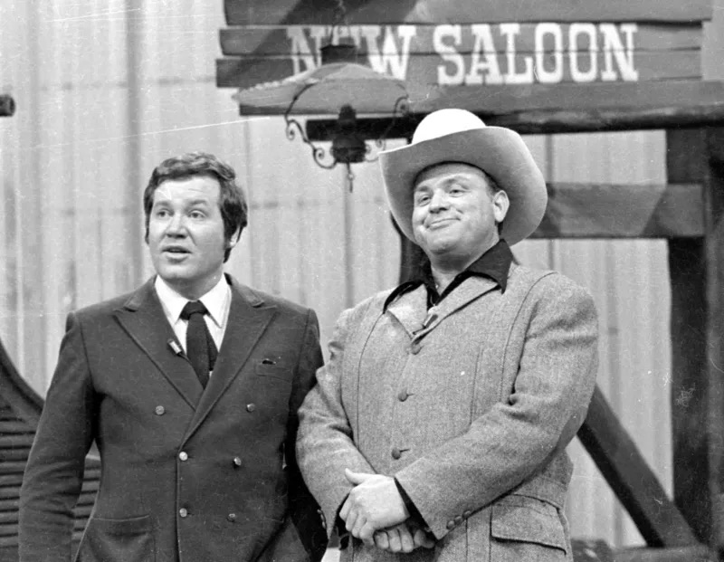 Dan Blocker (Hoss Cartwright) sharing the screen with another actor on the set of "Bonanza," offering a glimpse into the iconic Western television show