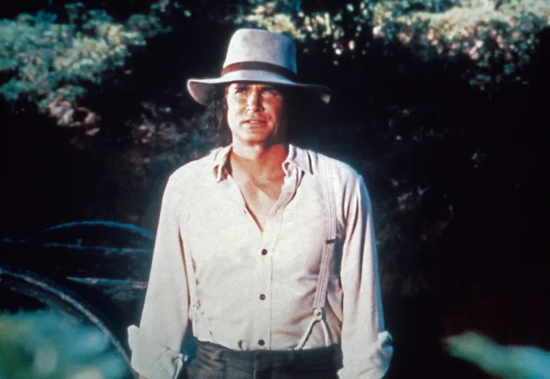 Michael Landon portraying Charles Ingalls in the hit TV show "Little House on the Prairie." His role on this show cemented his status as a television icon after "Bonanza.