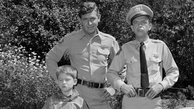 Andy Taylor, Opie, and Deputy Barney Fife (Don Knotts) in a classic scene from The Andy Griffith Show, representing the show’s down-to-earth charm and comedy