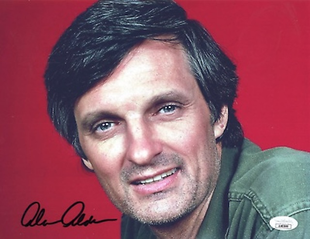 A signed headshot of Alan Alda in his iconic role as Hawkeye Pierce from "M*A*S*H", a character loved by millions for his wit, empathy, and resilience during the Korean War