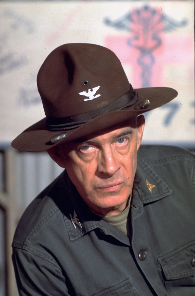 Colonel Potter's Fierce Leadership: A determined Colonel Potter with his iconic cavalry hat, reflecting the serious, no-nonsense side of his character on M*A*S*H, ready to command his unit