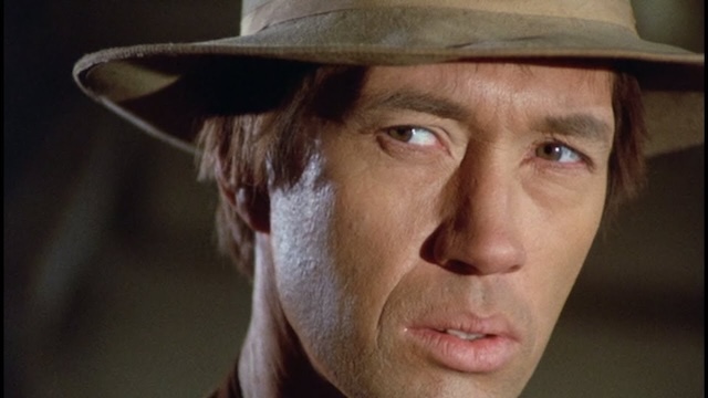 David Carradine delivers a striking performance as Clint in Gunsmoke, showcasing his range before starring in Kung Fu and Kill Bill.