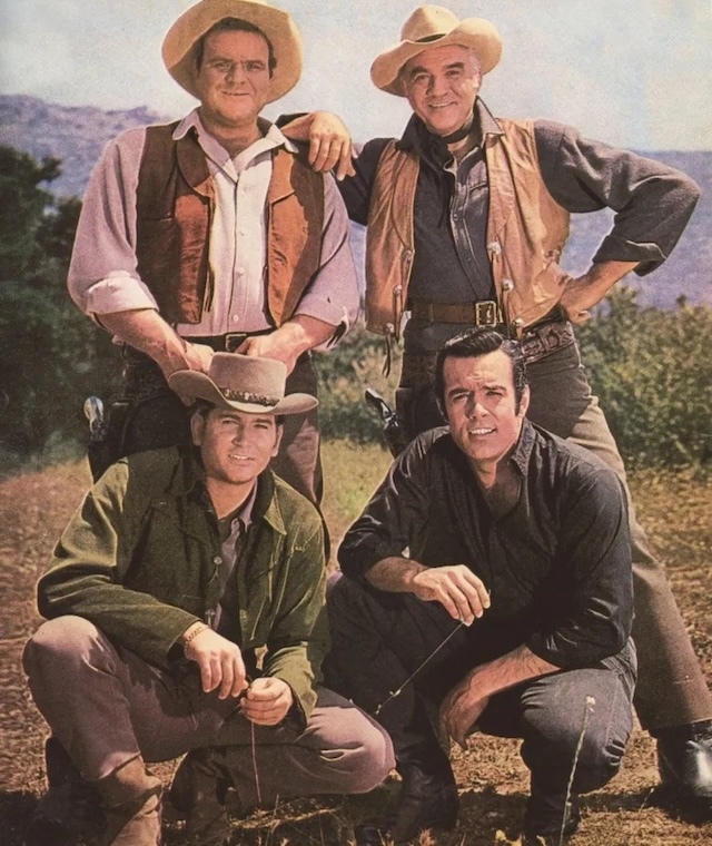  A rare posed shot of the four main characters—Hoss, Little Joe, Ben, and Adam—portrayed by Dan Blocker, Michael Landon, Lorne Greene, and Pernell Roberts