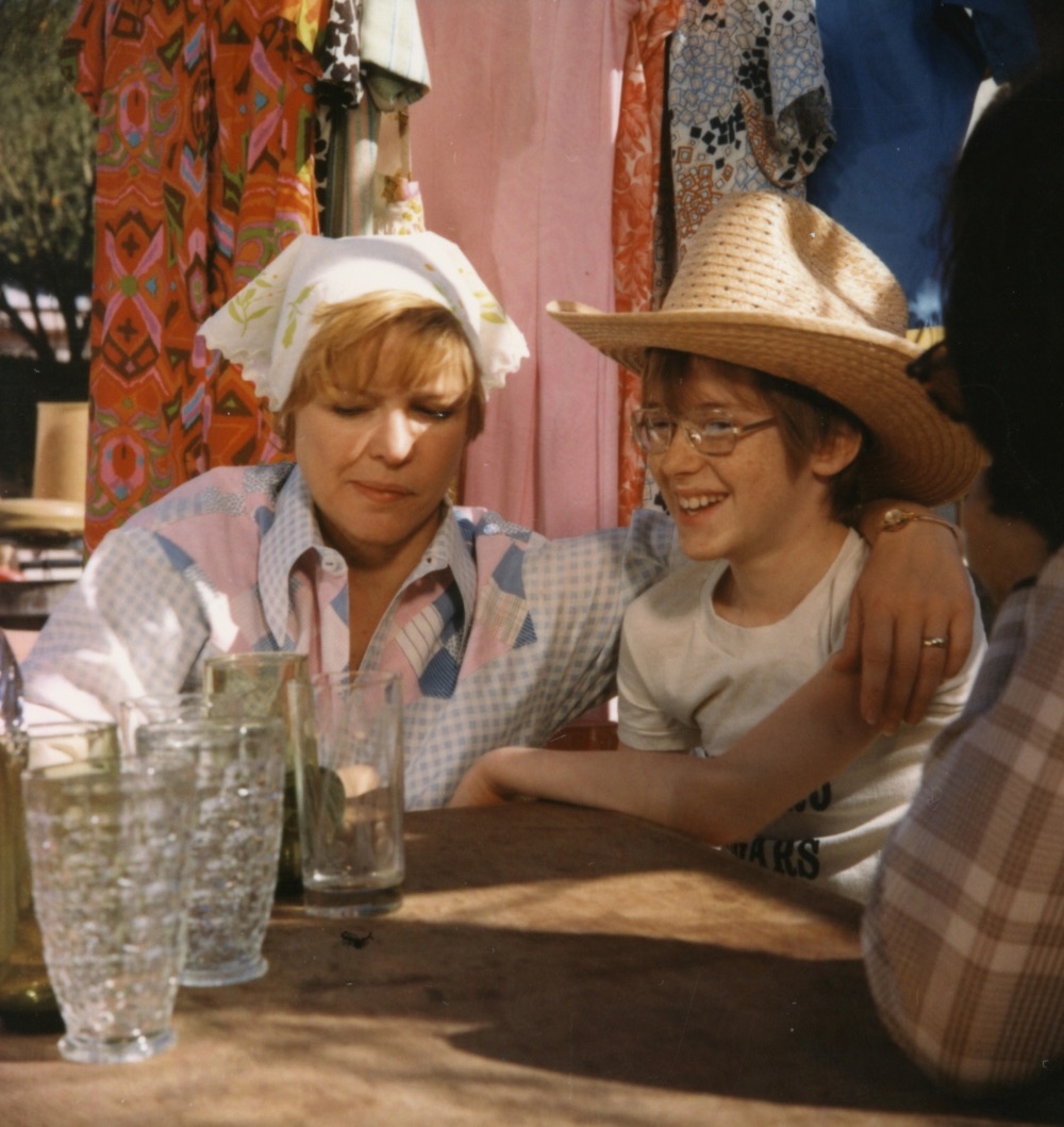 Behind-the-scenes photo from "Alice Doesn’t Live Here Anymore," featuring Ellen Burstyn and her on-screen son sharing a moment of laughter and bonding during filming