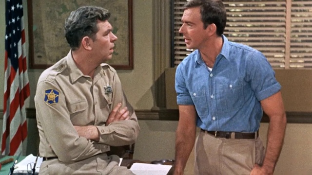 Andy Taylor and Sam Jones share a thoughtful conversation in the sheriff’s office, a passing of the torch between the two characters as the series transitions from The Andy Griffith Show to Mayberry R.F.D