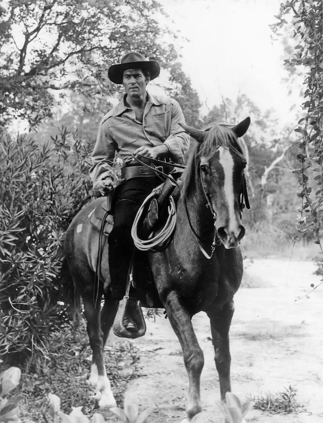 Clint Walker on horseback, ready for the next adventure - The essence of the Western frontier captured with one of the most beloved actors of the genre.