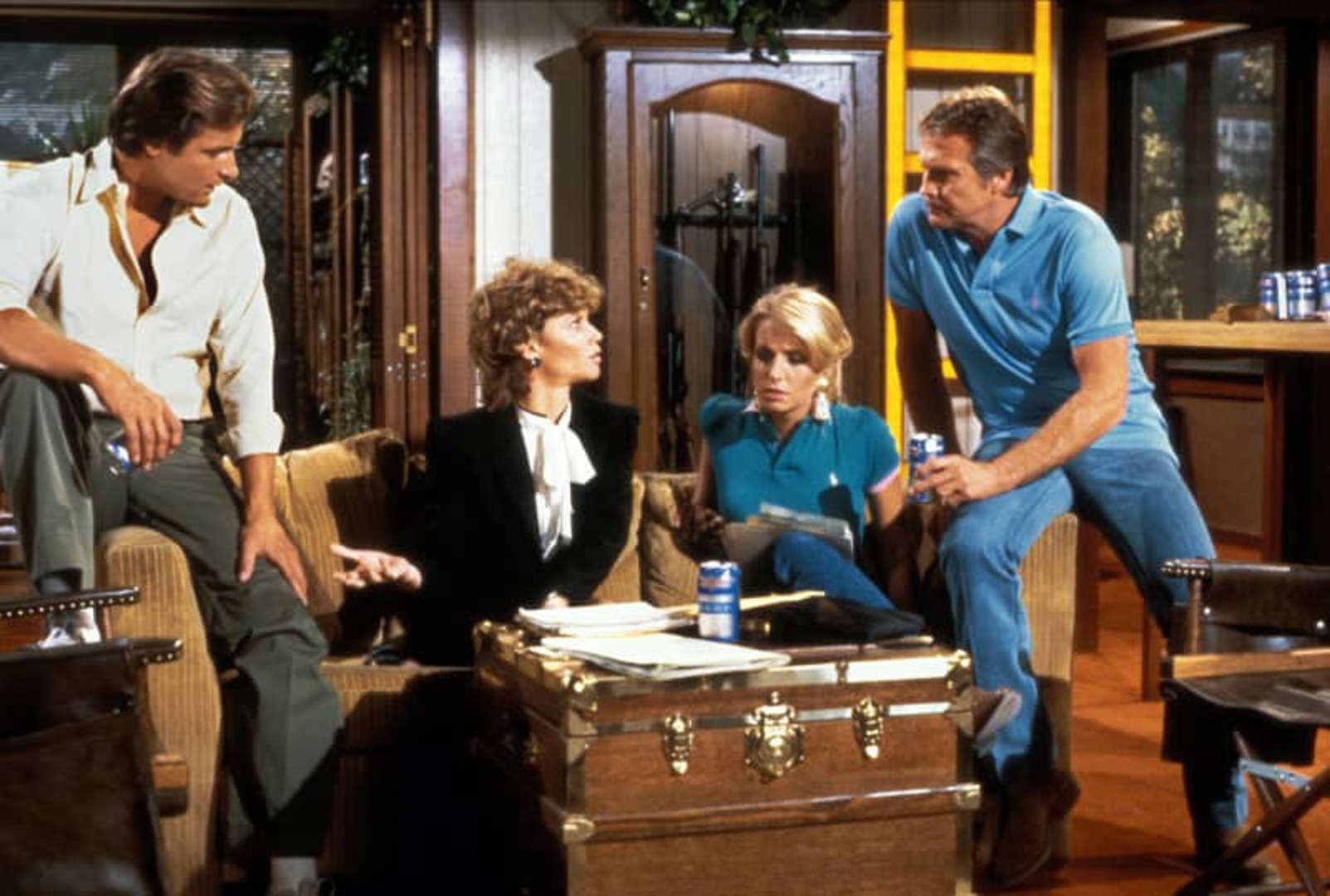 A behind-the-scenes moment with the cast of "The Fall Guy" planning their next thrilling stunt. Lee Majors, Heather Thomas, Markie Post, and Douglas Barr share a classic moment together