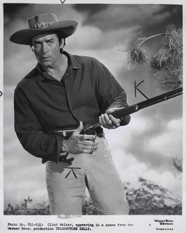 A determined expression as Clint Walker portrays the legendary scout and trapper in Yellowstone Kelly (1959), highlighting his rugged Western persona.