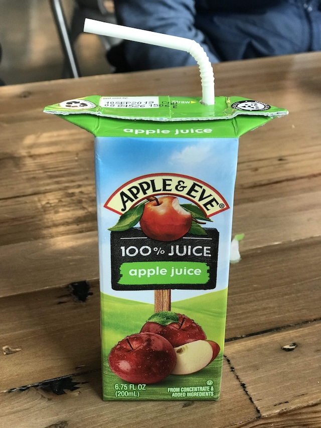 The raised flaps on the juice box provide a perfect spot to hold and sip without accidentally spilling.