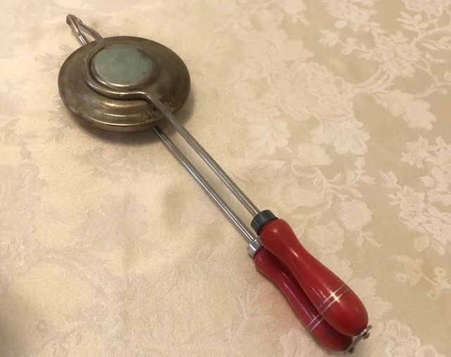 A well-loved classic Nutbrown sandwich toaster, showing signs of use but still reliable for making delicious sandwiches.