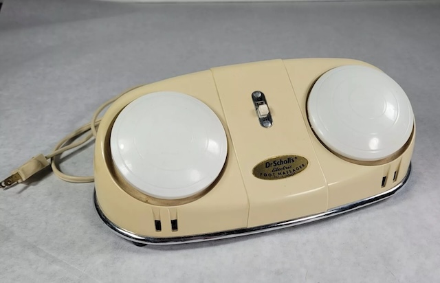 A close-up view showcasing the minimalist design of this vintage electric massager.