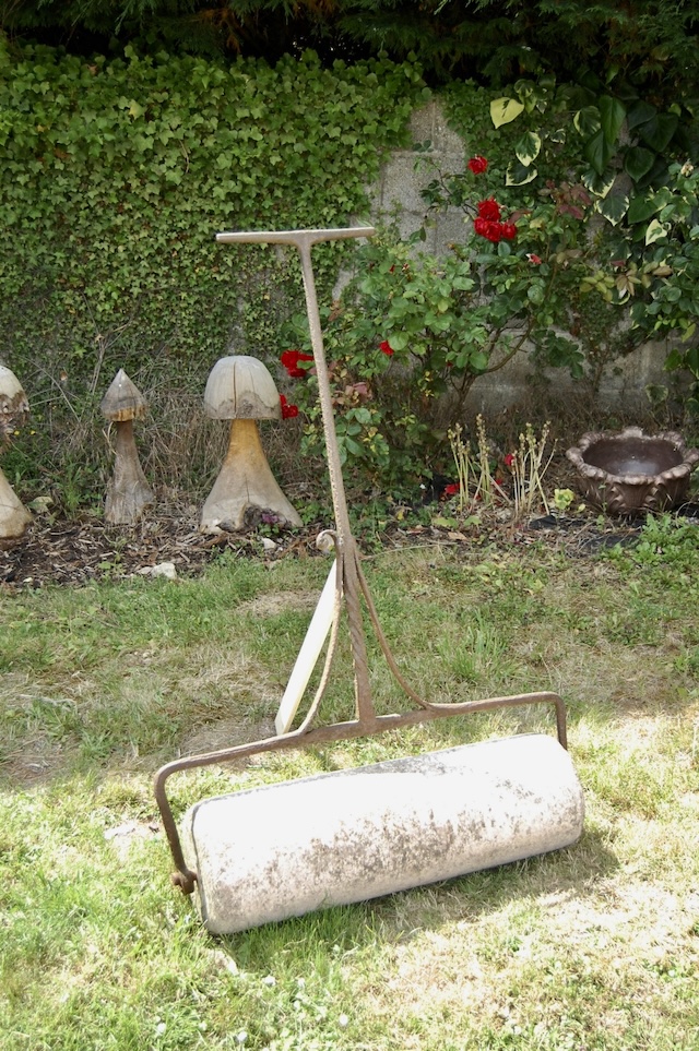 Another vintage tool used to flatten and smooth lawns after mowing or seeding, ensuring an even surface.