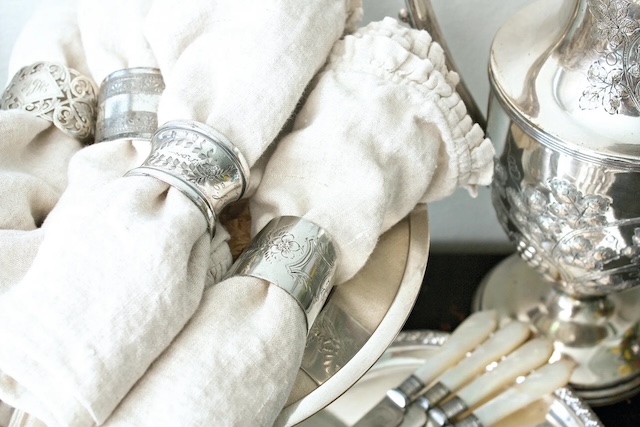 Set for a formal dinner, these vintage silver napkin rings highlight the timeless tradition of table setting with a touch of historical elegance