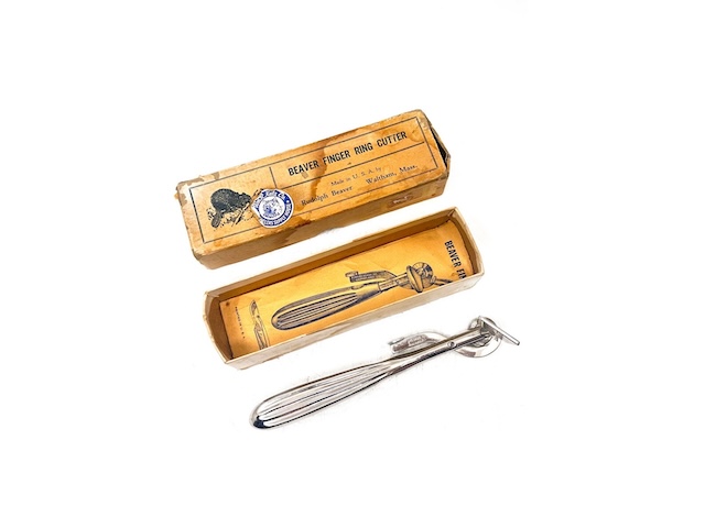 An antique boxed vintage ring cutter set, featuring classic 20th-century packaging