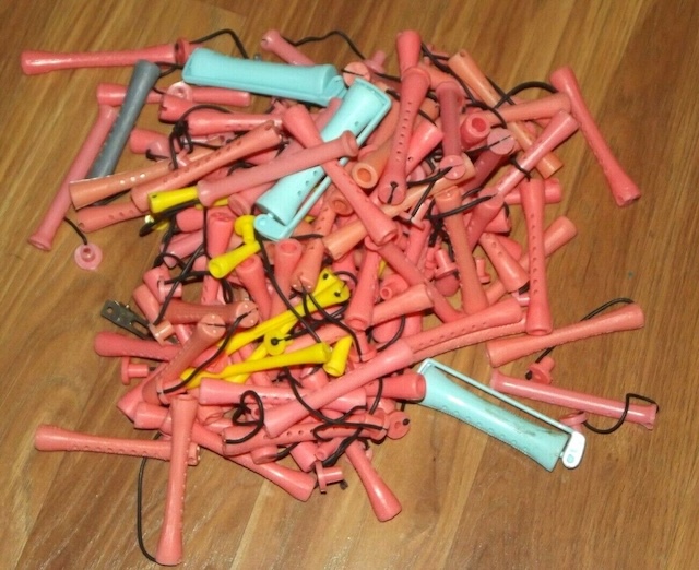 An assortment of perm rods in different colors, bringing back memories of classic salon visits.