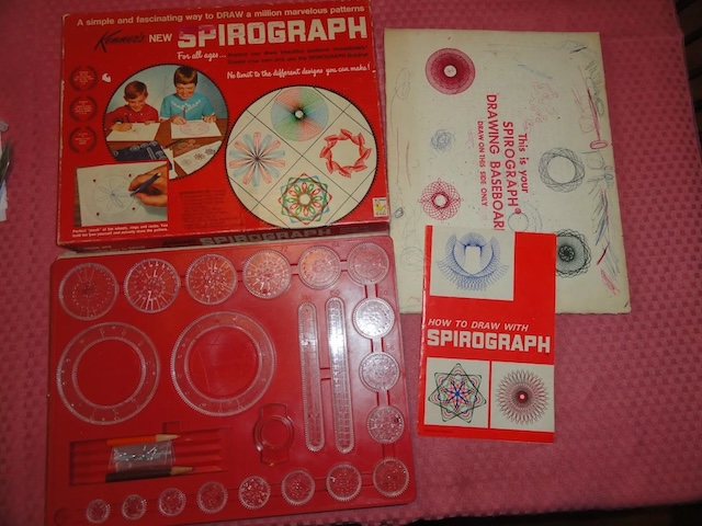 A full Vintage Spirograph kit, including a drawing baseboard, booklet, and plenty of gear wheels to spark creativity