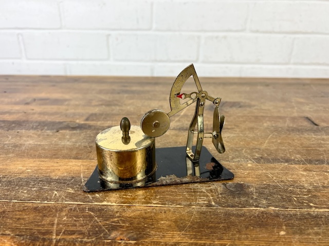 A close-up view of the brass tool paired with a dial mechanism—this was a must-have for precise measurements in a bygone era.